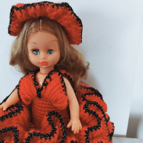 Vintage doll with embroidered dress like new, 32 cm