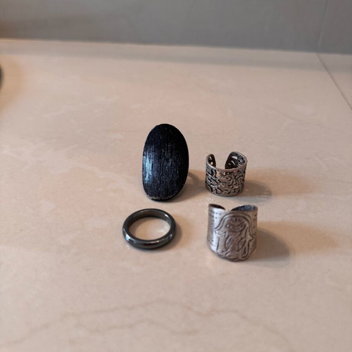 Rings set of 4 like new, black and silver