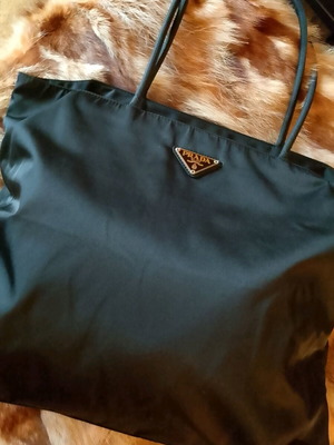 Prada black shoulder bag like new with interior tear
