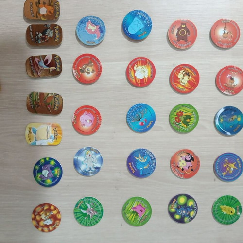 Pokemon Tazos pack of 47 and 5 gold plates like new