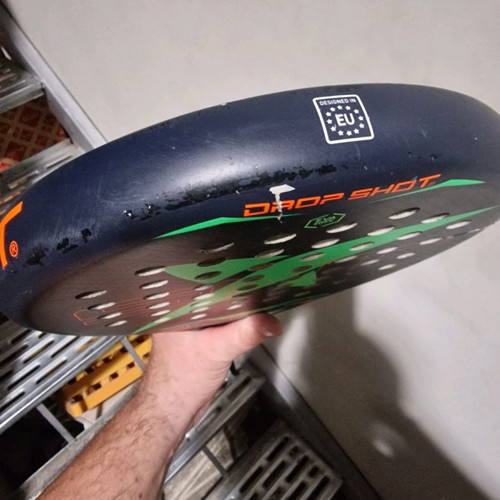 Padel racket used, moderate condition with small cracks