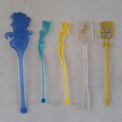 Set of 5 used plastic Caravel Hotel drink stirrers
