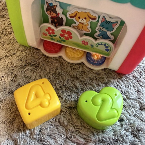 Baby toys set like new with shape matching eggs, house, and rattle gift