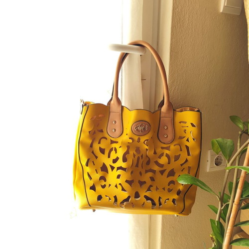 Yellow handbag used with beige details