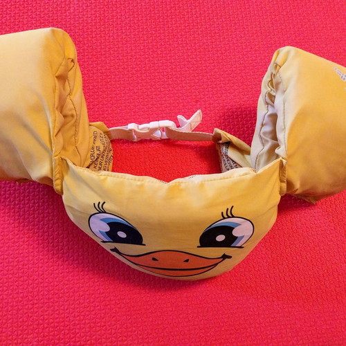 Child life jacket with integrated armbands used