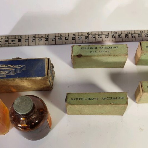 Antique staplers and two used bottles for decoration