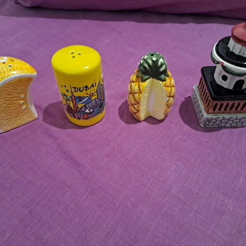 Salt and pepper shakers used, designs lighthouse, pineapple, Dubai