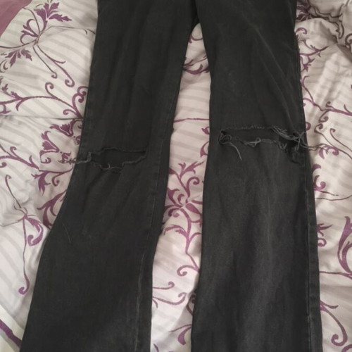 Stradivarius black denim pants used with flared legs and knee rips size S