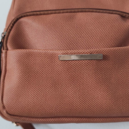 Back pack tan used with internal and external pockets