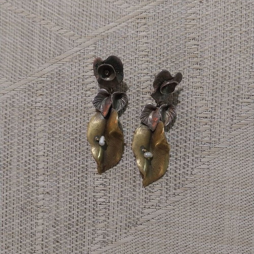Handmade earrings used, copper and tin alloys with pearl