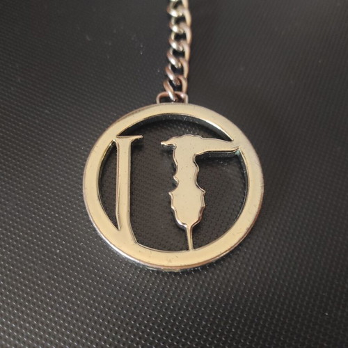 Trussardi bag charm new, silver and gold tone