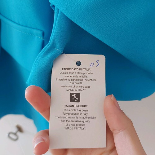 Blue jacket new with unique sleeve and tags