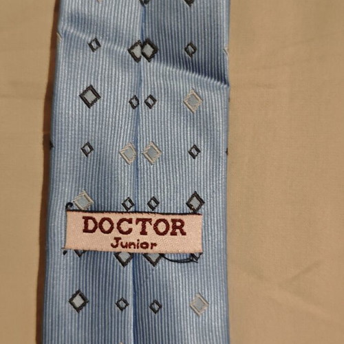 Children's tie light blue with diamond patterns like new
