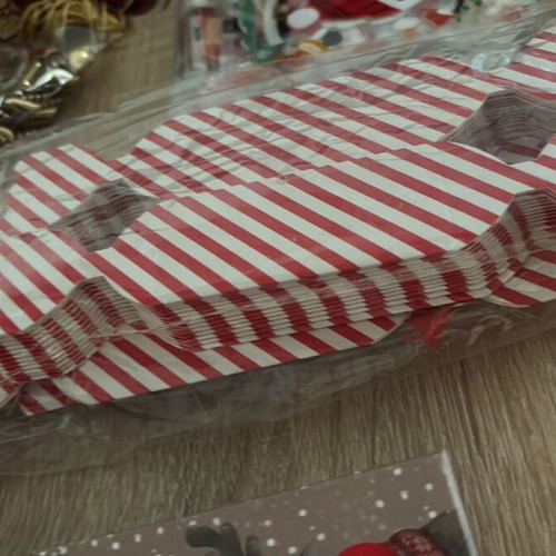 Craft supplies like new, boxes, stickers, decorative flowers and shells