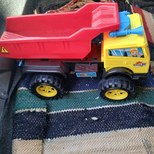 Plastic dump truck used, one horn broken