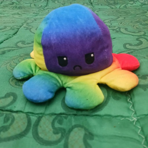 Colorful plush octopus happy or sad like new
