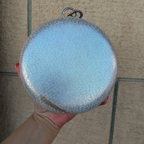 Round silver evening clutch bag with rhinestone ring handle used