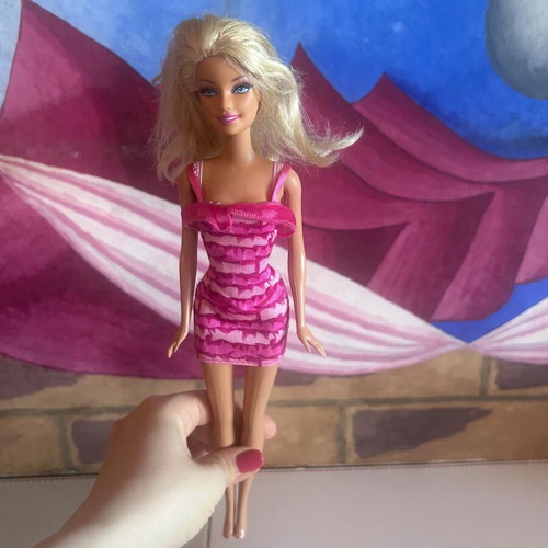 Mattel Barbie Beach doll with pink swimsuit and fuchsia dress