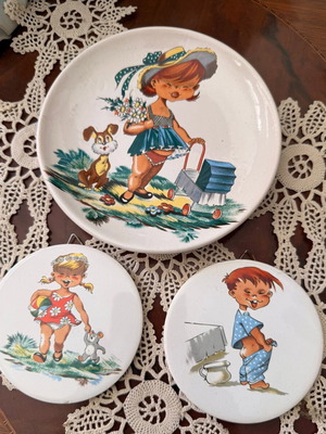 Ceramic vintage plates with children's figures used