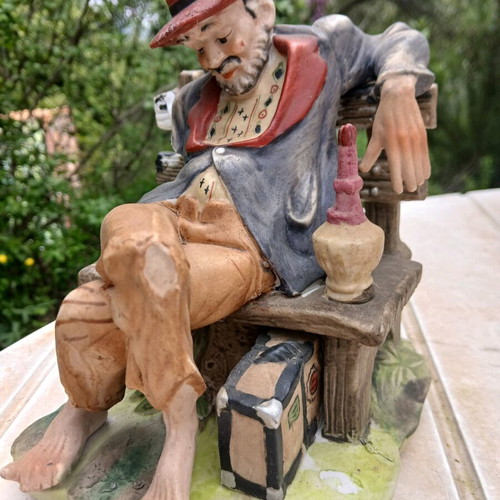 Traveler figurine used, missing one hand