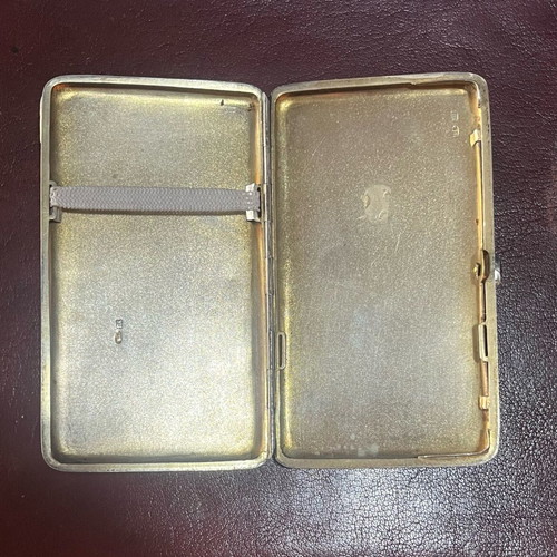 Silver cigarette case used with red stone and gold plating