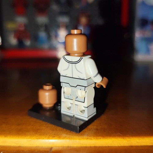 Lucan minifigure like new with base and extra head
