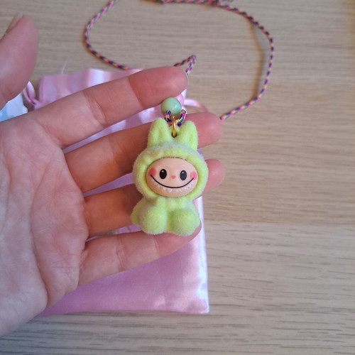 Labunoma necklace with colorful fuzzy smiling monster charm, like new