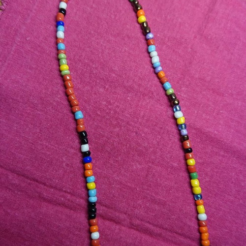 African necklace like new with cloth for storage or cleaning