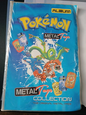 Pokemon album used with 200 metal tags from various collections