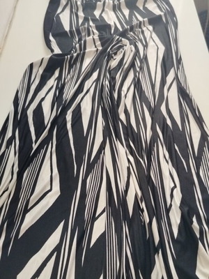 One-piece black and white jumpsuit like new with removable black straps