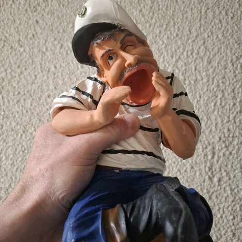 Porcelain figure new, man sitting on barrel