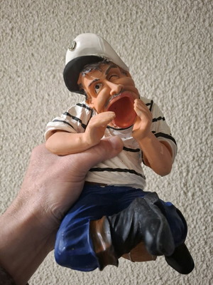 Porcelain figure new, man sitting on barrel