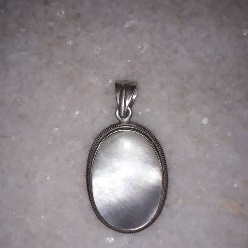Silver pendant used with hallmark