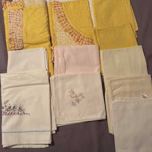 Baby bedding set like new, 12 sheets for basket, stroller, crib, and cuddle