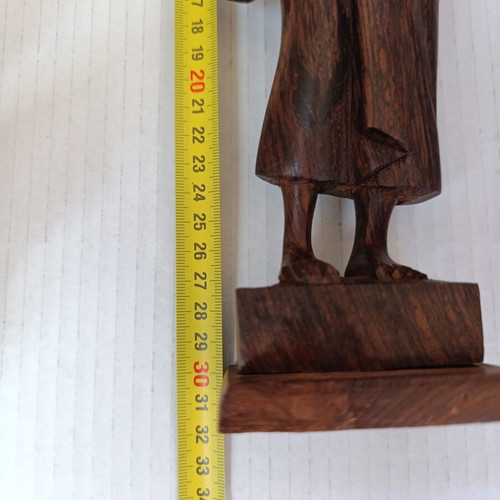 Rosewood figure of woman with basket from Bali, like new