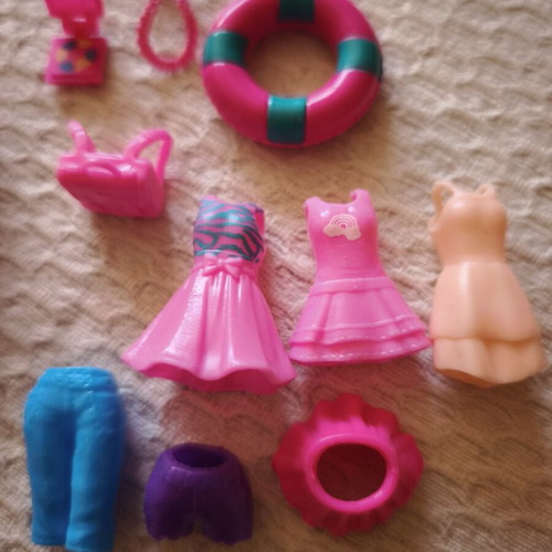 Polly Pocket doll with original clothes and shoes, used