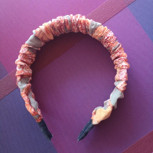 Orange headband with paisley pattern new