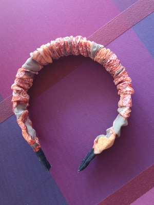 Orange headband with paisley pattern new