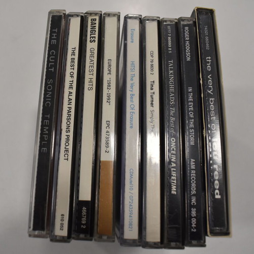 Music collection of 360 rock, pop, metal CDs, 29 music DVDs, 2 VHS tapes, with 2 CD shelves