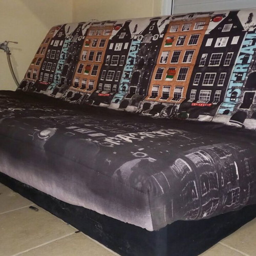 Sofa bed used, three-seater black with Amsterdam cover and storage