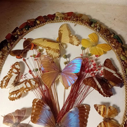 Vintage framed art with colorful stones and butterflies