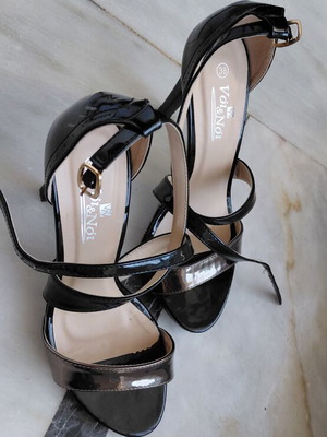 Black patent leather women's sandals with silver detail