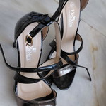 Black patent leather women's sandals with silver detail