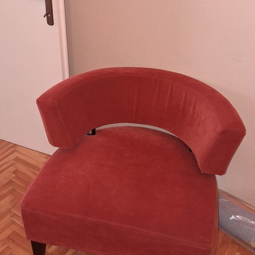 Modern burgundy fabric armchair with wooden legs