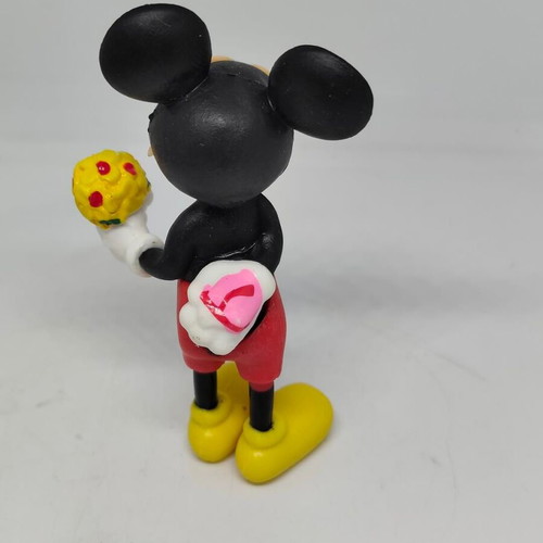 Collectible Mickey Mouse figure like new with bouquet