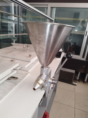Manual dough depositor with stainless steel hopper and lever