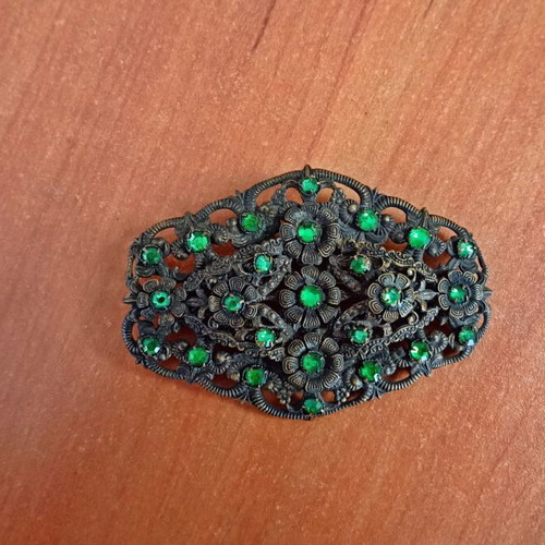 Vintage brooch used with floral filigree design and green stones