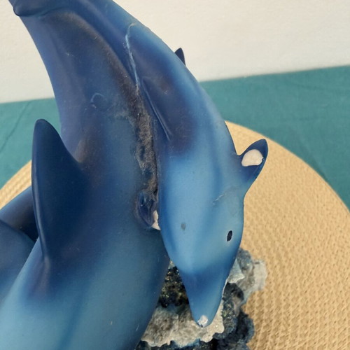 Decorative dolphins refurbished with damage