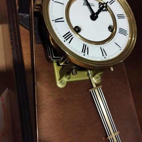 Wooden wind-up pendulum clock used with Asso mechanism