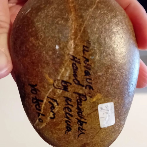 Painted pebble with dolphin theme, signed and varnished